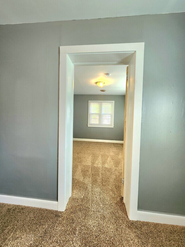 third bedroom entry from second bedroom - 321 Stonewall Ave S