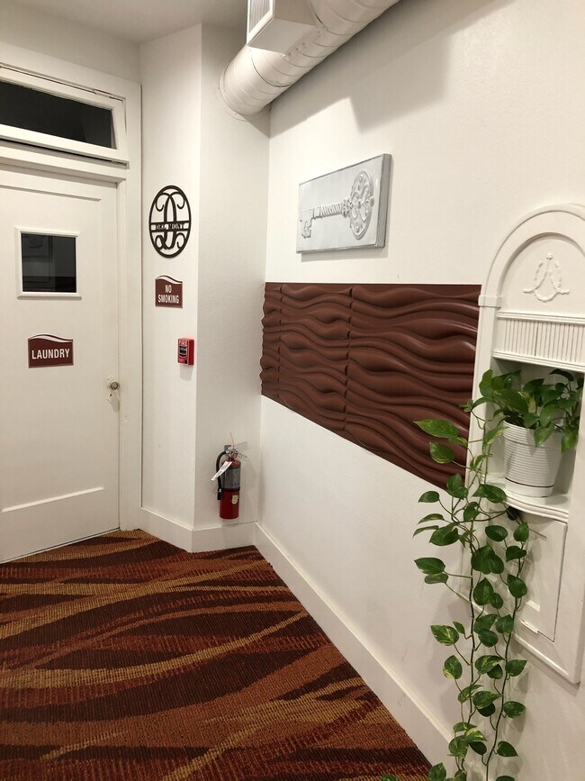 Hall w-original phone stand & Laundry door - The Del Mont Lofts
