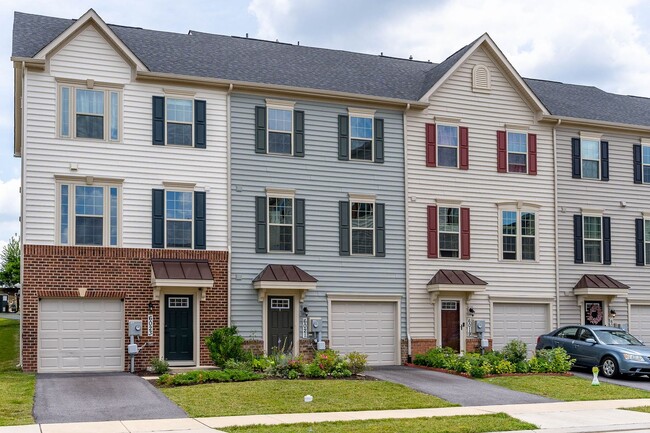 Building Photo - Townhouse with 1-Car Garage, Rooftop Deck ...