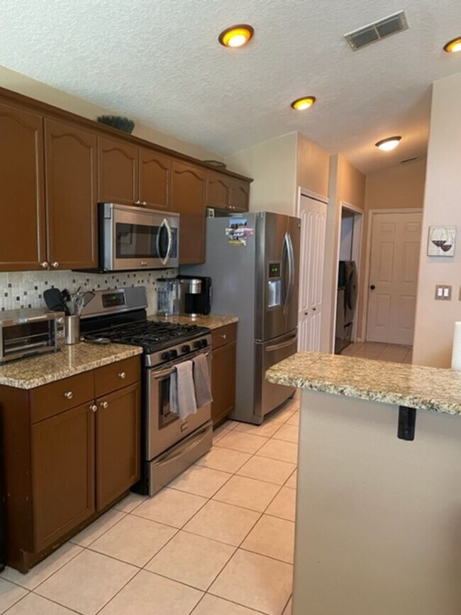 Building Photo - Lakefront 3-Bedroom Pool Home in Gated Com...