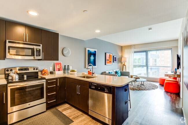 Open concept floorplan with kitchen view into living area - Zinc