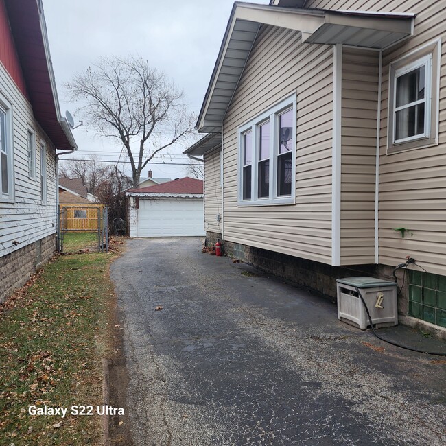 View of driveway from sidewalk - 7141 Jackson Ave