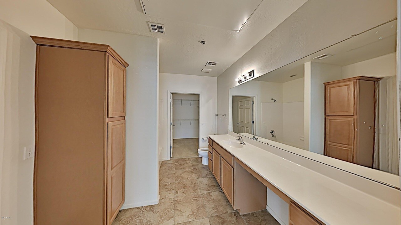 Bathroom with large walk in closet - 14575 W Mountain View Blvd