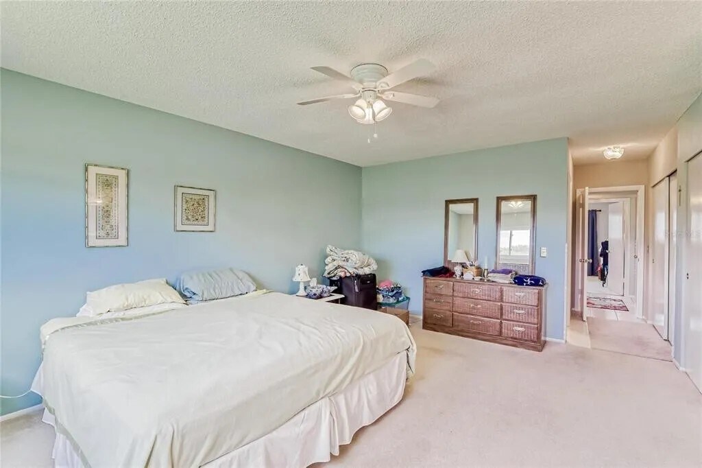 Master bedroom has 2 closets, ceiling fan, bathroom & view of golf course. Walls have been repainted - 2460 Franciscan Dr