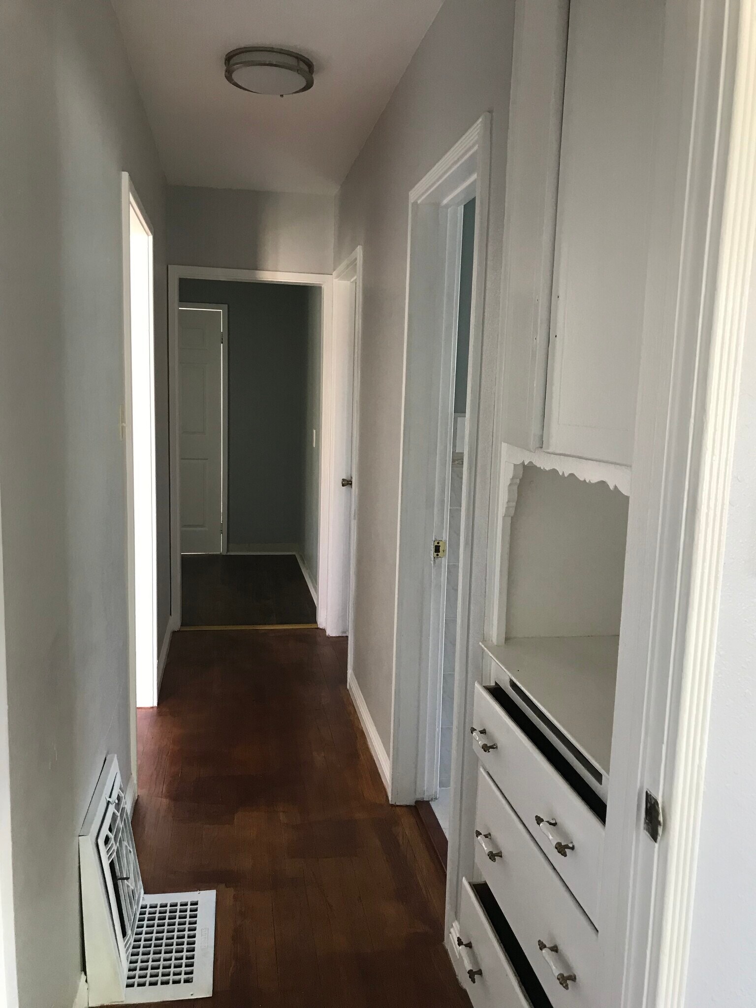 hallway with closet space and entrance to rooms and bathroom - 8432 Norwood Plz