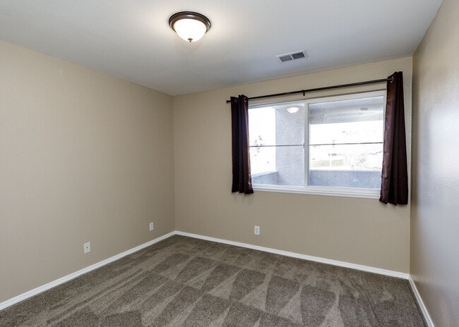 Building Photo - 3 Bed Top Floor Condo near Ft. Carson in Gated Community with detached Garage
