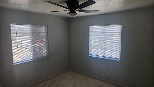 Building Photo - Three Bedroom Two and a half bath house, 2 car garage, central air. Available now.
