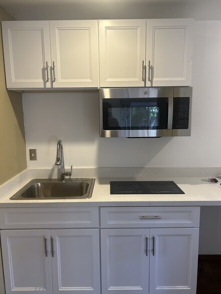Kitchen sink, cabinets and microwave - 148 Kathryn Dr