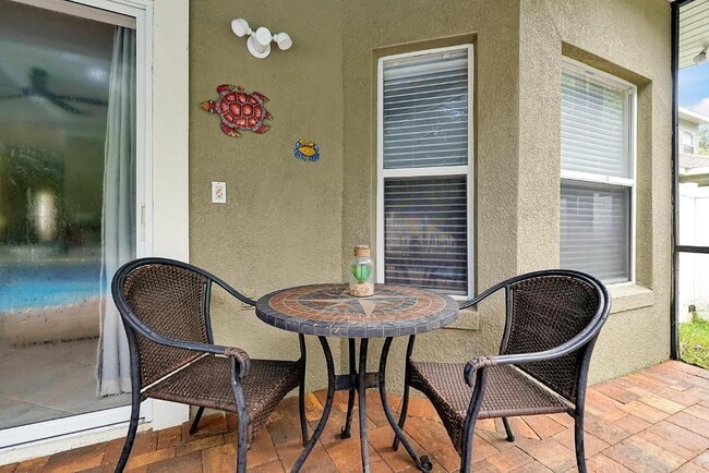 Building Photo - "Stunning Fully Furnished 3BR Orlando Home with Private Screened Pool, Spa & Spacious Living Areas"
