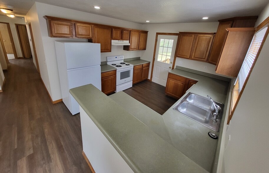 Kitchen with Breakfast Bar - 2675 N National Ave