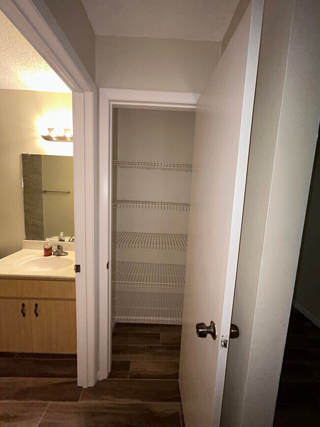 Storage in bathroom - 6501 72nd Ave N