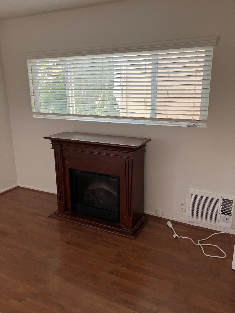 Second bedroom with new air conditioner and fireplace - 1123 S Wooster St