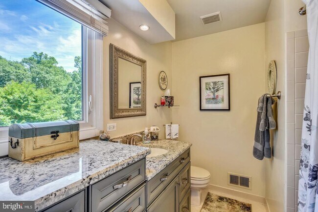 Building Photo - Experience elevated living in this beautifully renovated townhome nestled within the highly sough...
