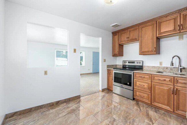 Building Photo - Beautiful 4-Bedroom Home with Finished Bas...