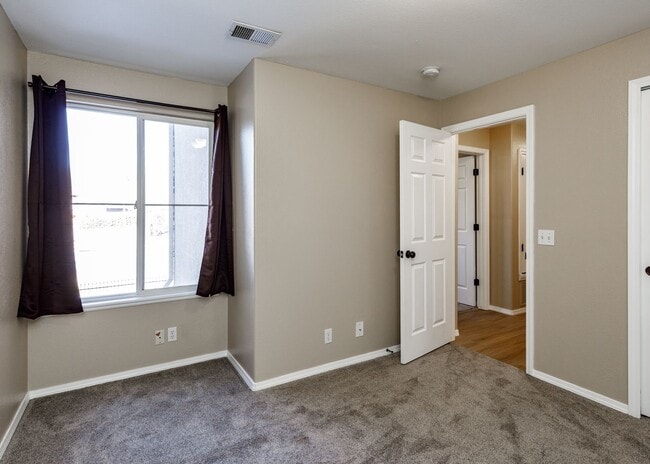 Building Photo - 3 Bed Top Floor Condo near Ft. Carson in Gated Community with detached Garage