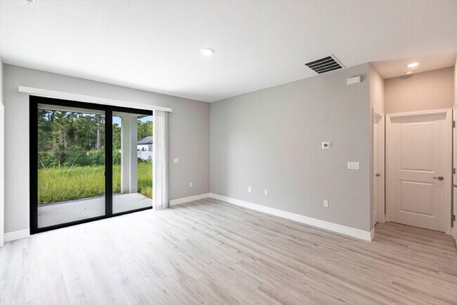 Building Photo - Brand New 4-Bedroom Gem with 2 Full Baths on Large Lot in Lehigh Acres – A Perfect Family Haven!