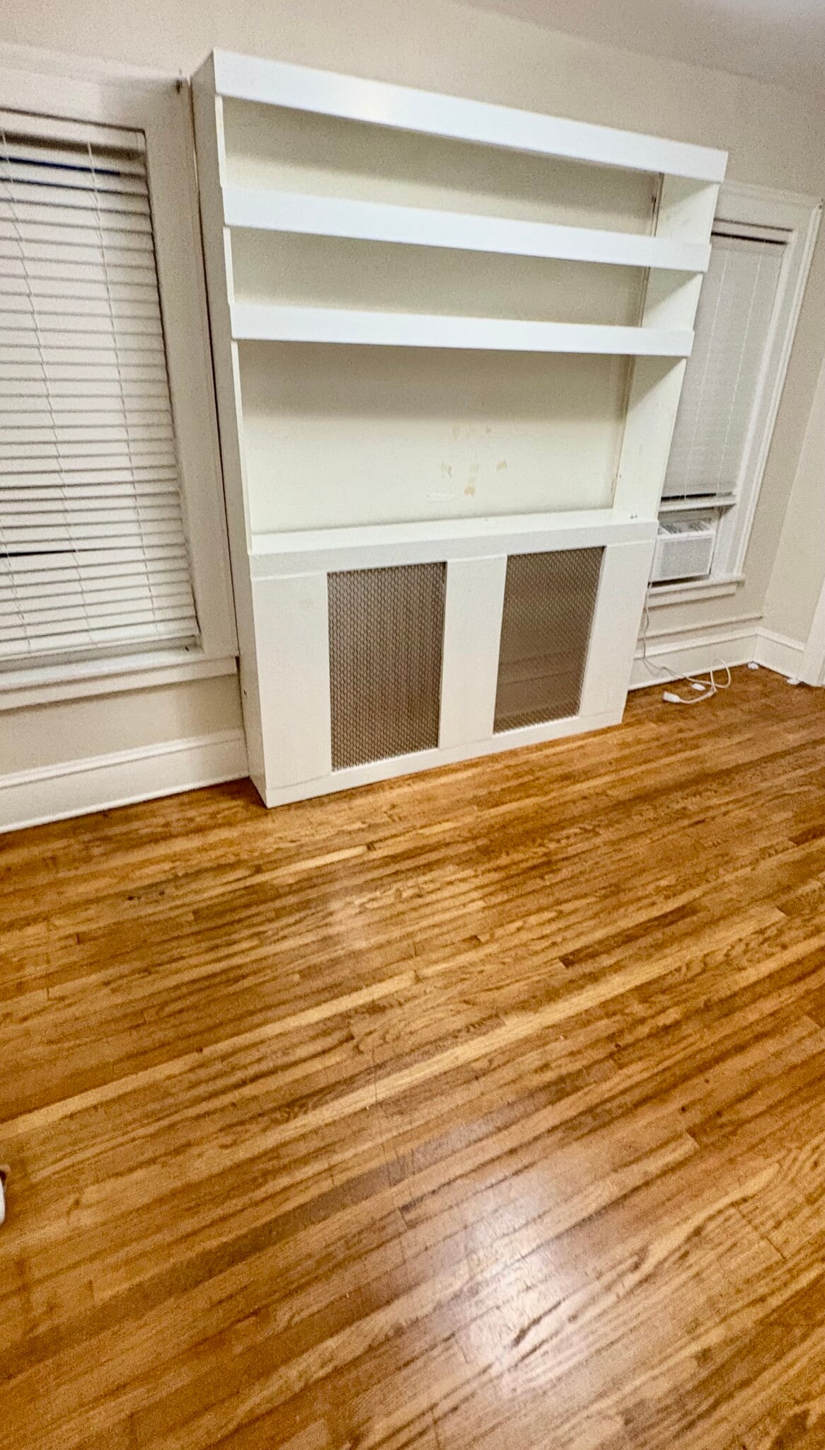 Living room with built-in entertainment center shelf - 52 Genesee St
