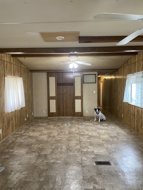 Looking from kitchen into Living room with vaulted ceiling - 16550 County Road 282