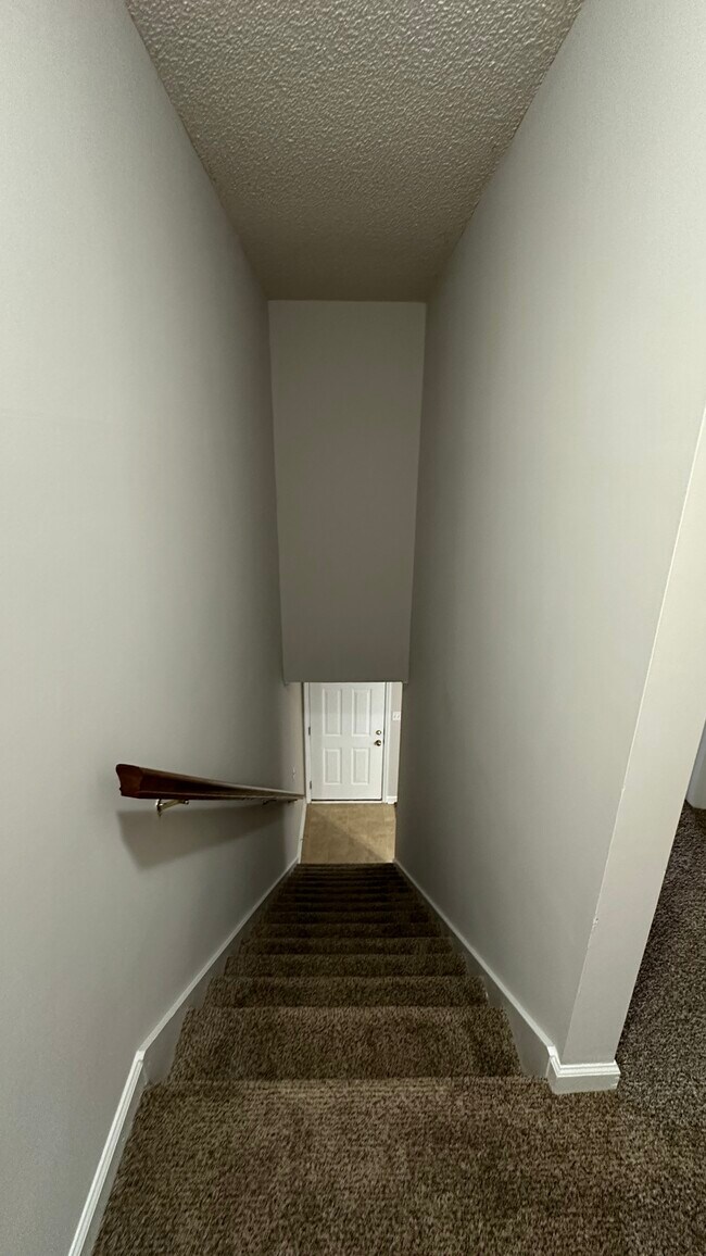 Stairs to upstairs bedrooms and full bathroom. - 1211 Goldridge Dr SW