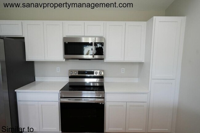 Building Photo - "Contemporary Ranch-Style Living: Immacula...