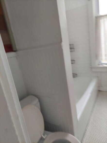 Full bath with heated mosaic floor tile - 705 W Healey St