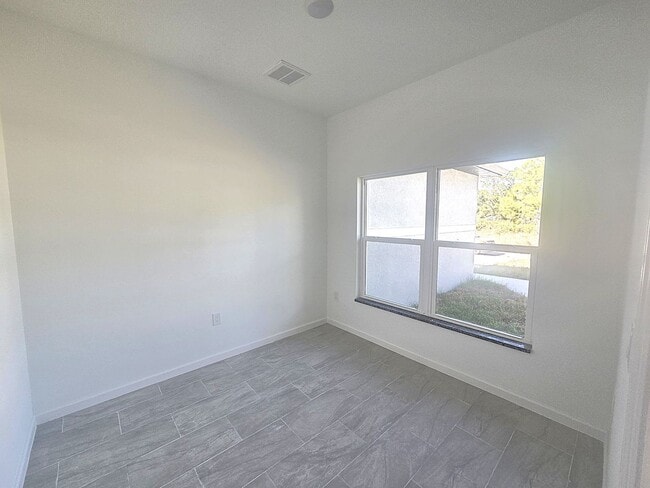 Building Photo - Brand New 4/2/2- South Lehigh Acres