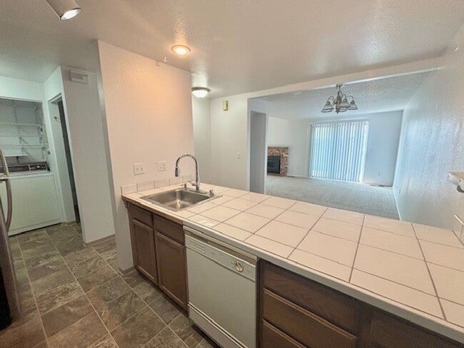 Building Photo - DES MOINES CONDO WITH PEEK-A-BOO SOUND VIEWS & PRIVATE GARAGE!