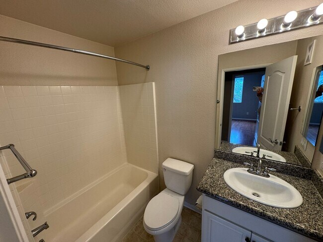 Building Photo - Sleek 2-Bed with a Den/Office + Flex Corner Condo with Attached Tandem Garage