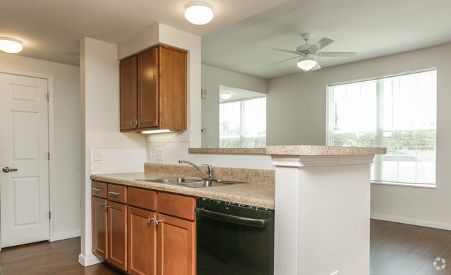 2BR, 2BA - 920SF Kitchen Island & Living Space - East Meadows Apartments