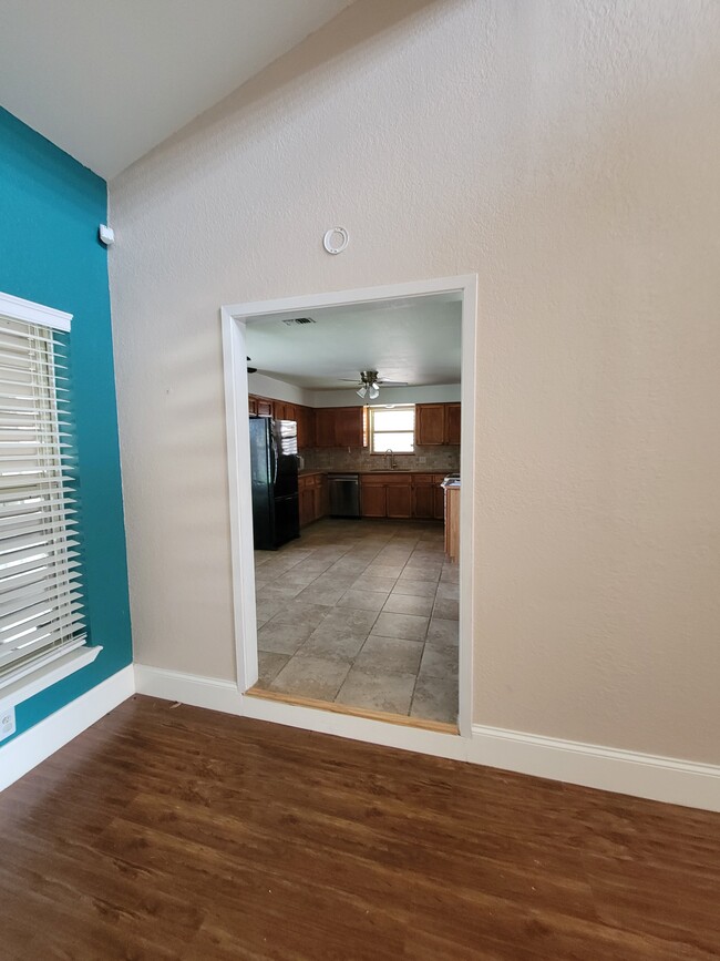 living room into kitchen - 7446 Cessna Dr