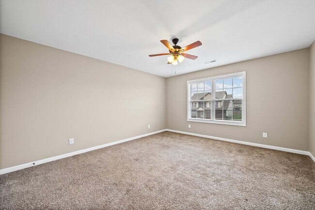 Building Photo - Four Bedroom with Three Car Garage!