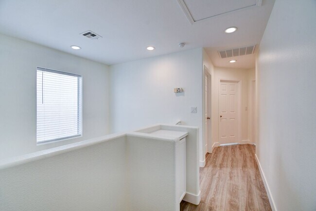 Building Photo - Great home with 4 bedrooms, 2.5 baths. New Floors Paint and Countertops.