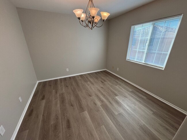 Building Photo - Spacious Tri-Level 4-Bedroom Home with Bal...