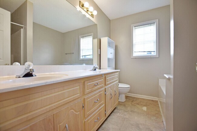 Building Photo - Pet Friendly Three Bedroom with Bonus!