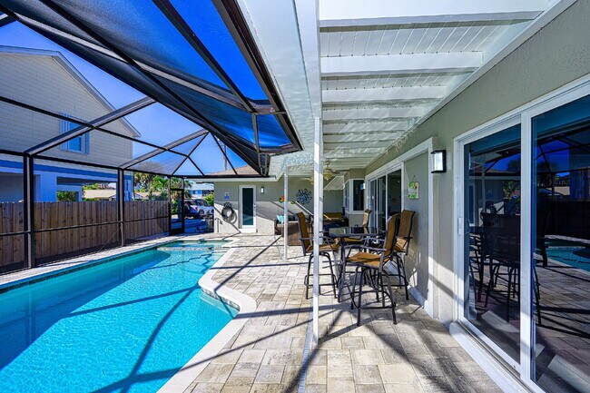 Building Photo - Waterfront Furnished Pool Home with Gulf & Canal Views in Estero Bay Shores