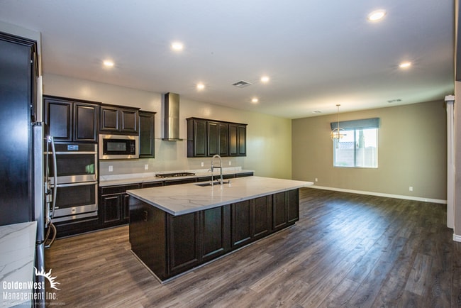 Building Photo - Welcome to this impressive single-story 4Bdm 3.5Ba residence located in a desirable Northwest Las...