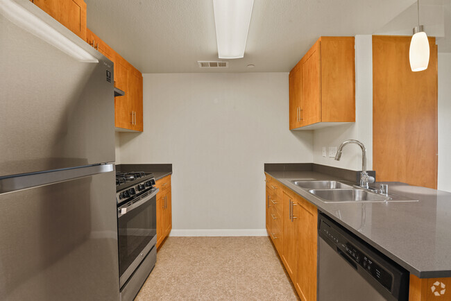 Modern kitchen with tile floors - Avenue Heights Apartments Building 1