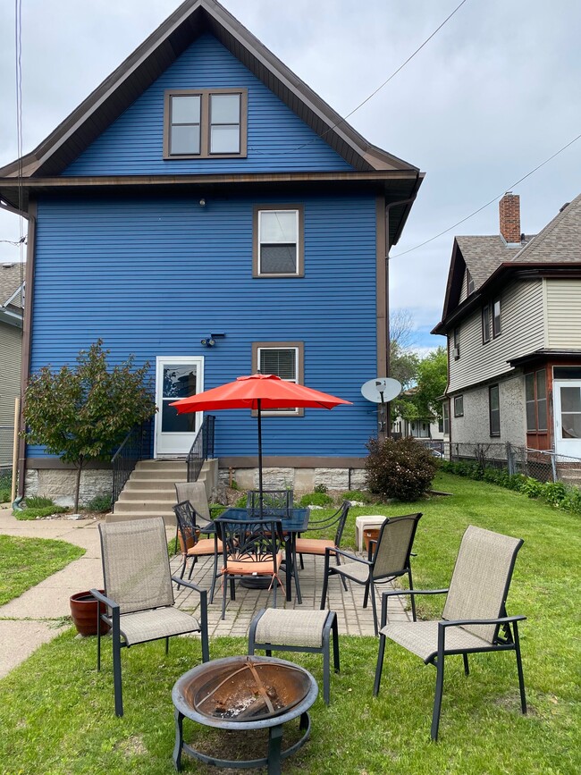 Huge south facing backyard with patio and dining set - 940 Marshall Ave