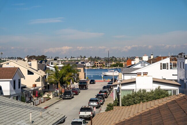 Building Photo - "Coastal Tommy Bahama at 208 East Balboa: Fully Furnished 3-Bed Sanctuary with Rooftop Deck