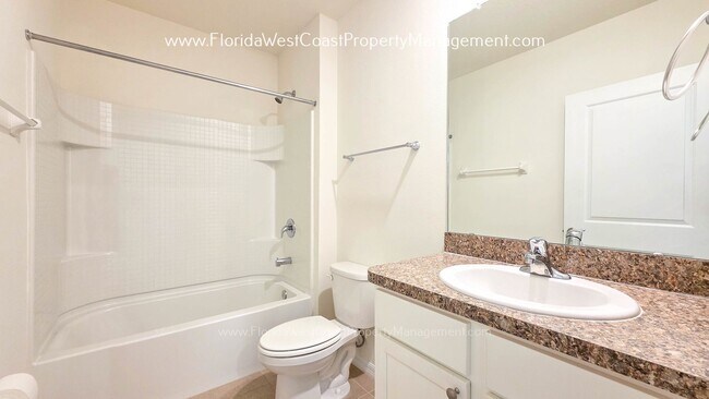 Building Photo - MOVE IN READY ! 4 BEDROOM/2 BATH! TILE- LVP THROUGHOUT! LAWN MOWING INCLUDED!