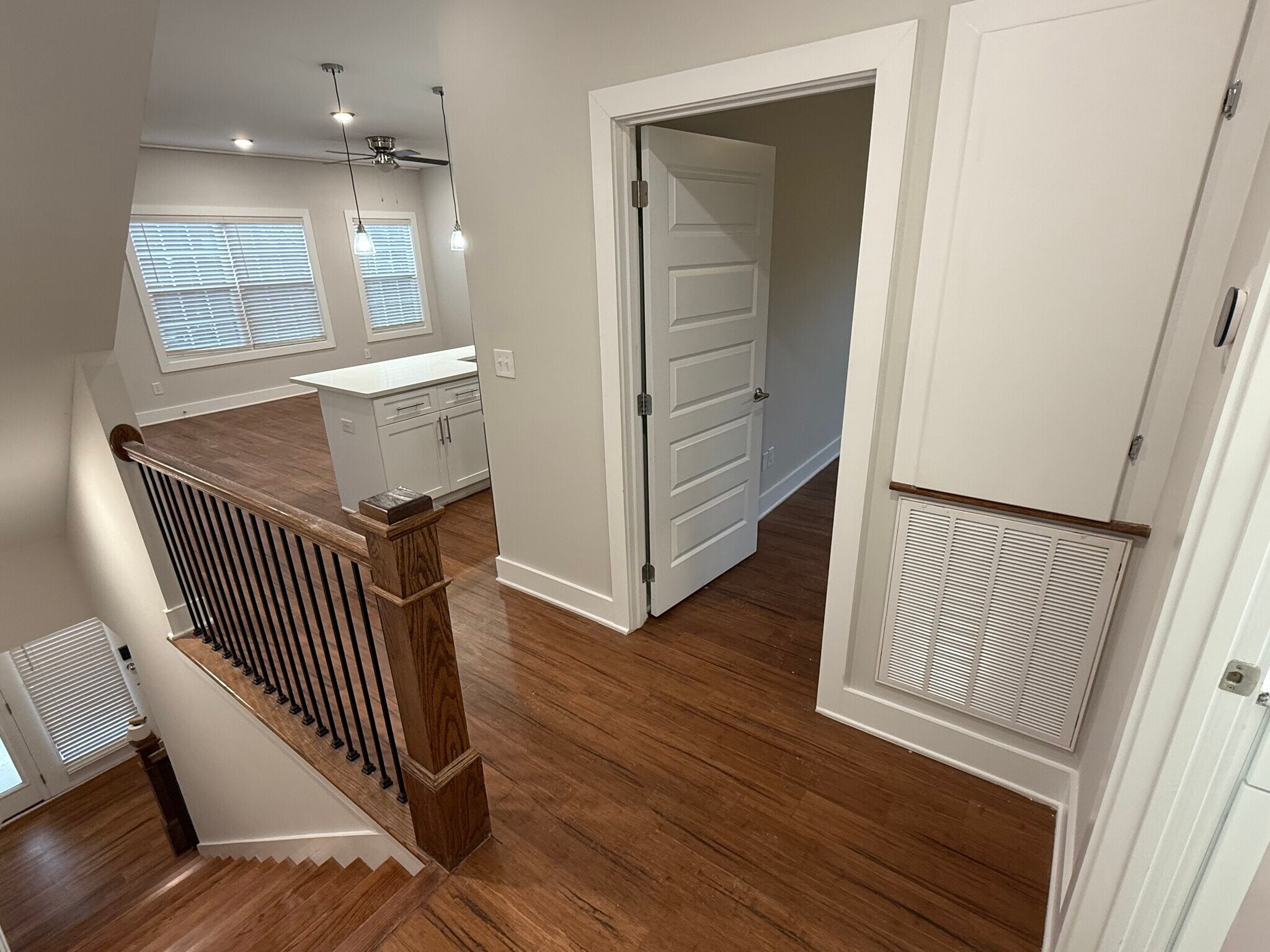 Second-Floor Landing: Bright, open, connecting the living area, full bathroom, and private bedroom. - 421 Elysian Fields Rd
