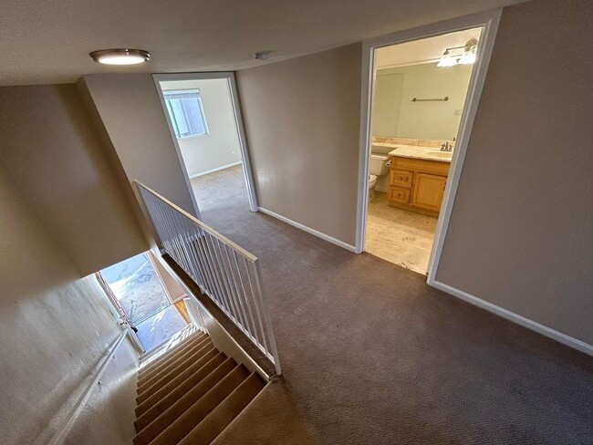 Building Photo - 2 Bedroom 1.5 Bath Townhome. Gated Community. Upgraded & 2 Parking Spaces
