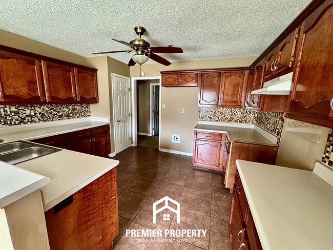 Building Photo - Spacious 3BR/2BA Near Southwind | 1,958 Sq Ft, Brick Fireplace, 2-Car Garage & Quiet Cove