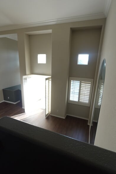 Overlooking the living room area on top level - 8894 Spectrum Center Blvd