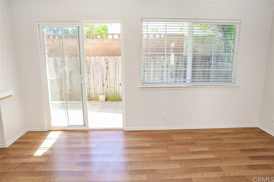 Living room leads to back patio space - 3051 Augusta St