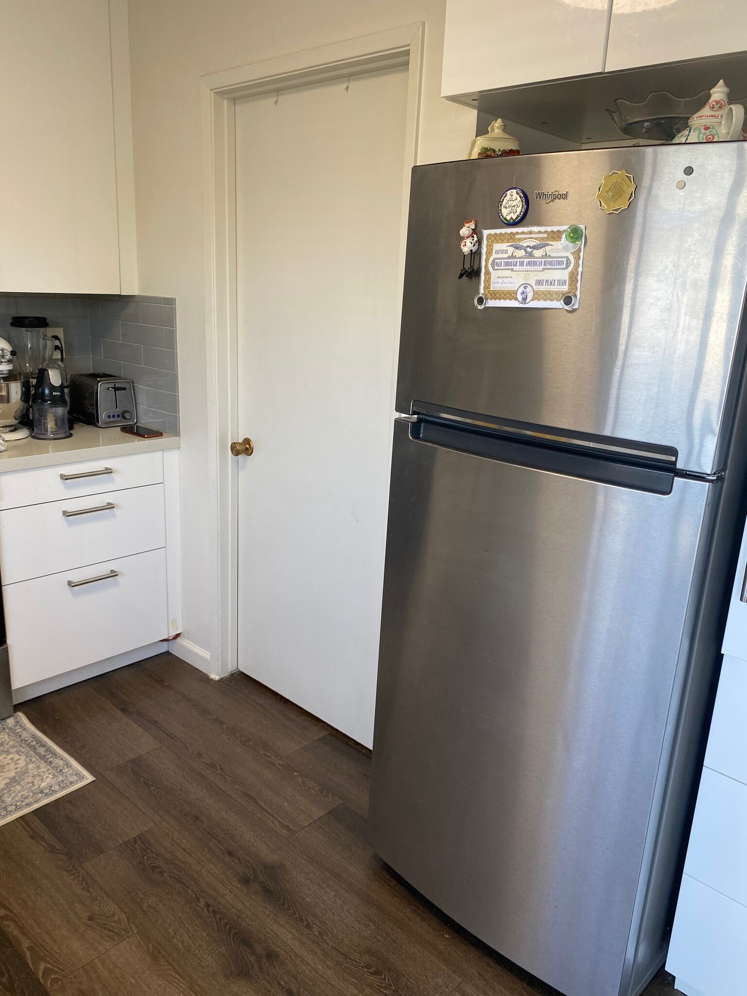 View of fridge and laundry room - 3912 Haussman Ct