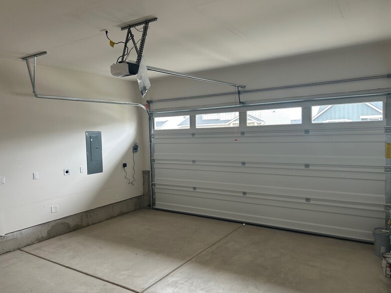 Two Car Garage is 24 feet deep on one side - 535 Withers Ct SE