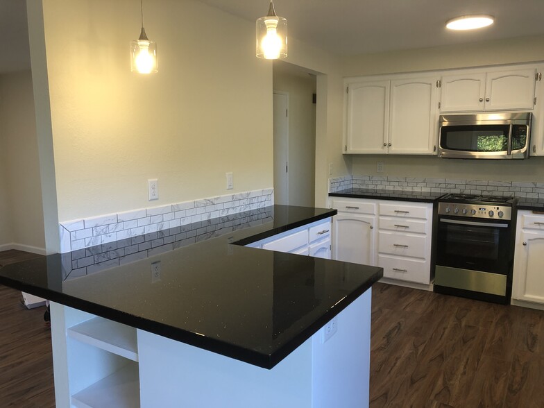 Newly updated kitchen with a large breakfast bar - 1889 12th Ave SW