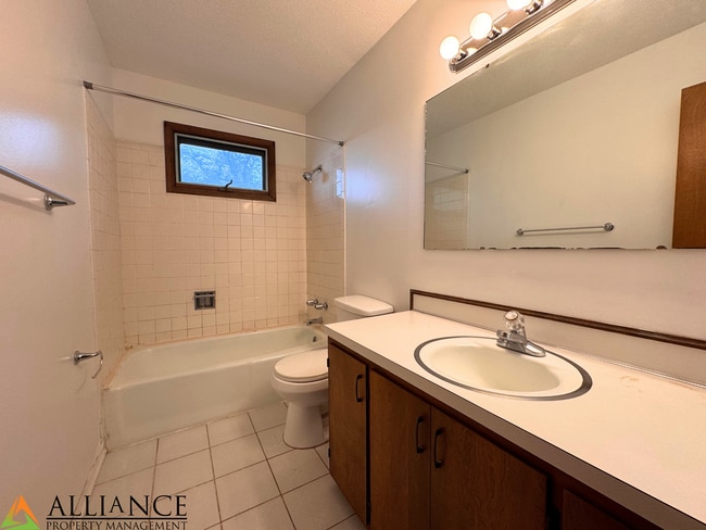 Building Photo - Home with Fenced Yard~Great West Side Loca...