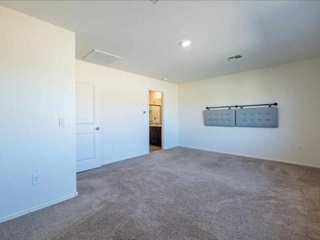 Building Photo - Spacious 4-Bedroom Home with Open Layout & Turf Backyard